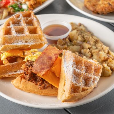 Chicken and bacon waffle sandwich with cheddar and heavenly potatoes