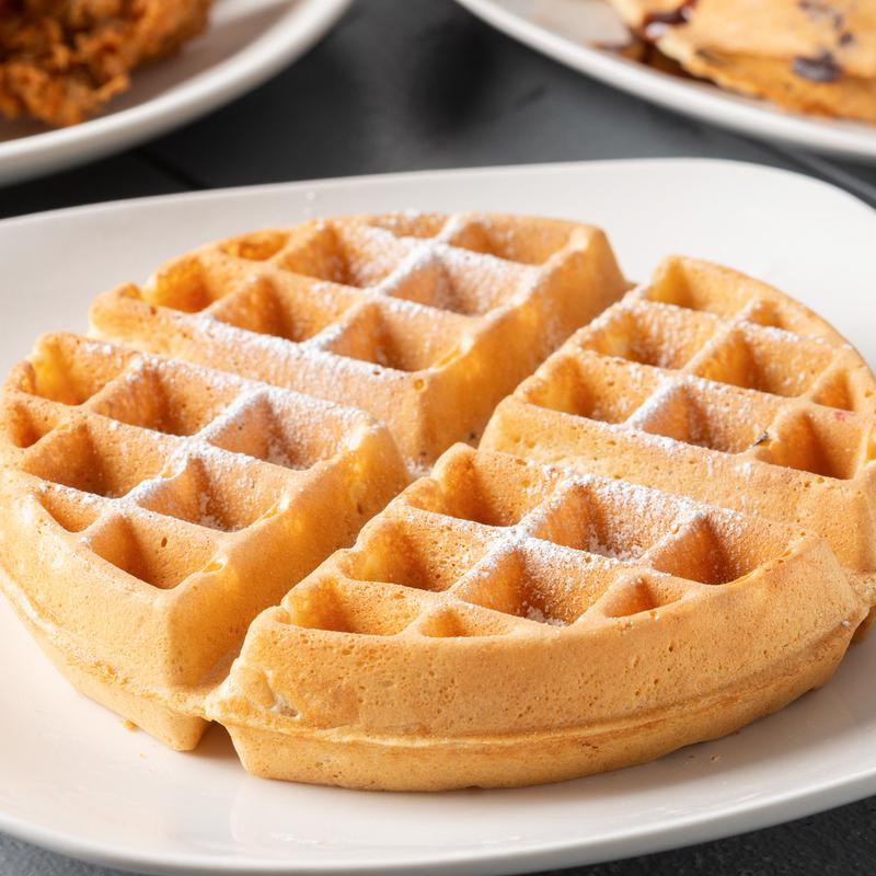 Belgian waffle dusted with powdered sugar