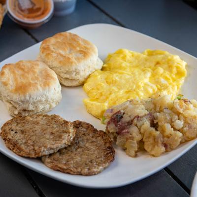 Buttermilk biscuits with scrambled eggs, sausage patties and heavenly potatoes